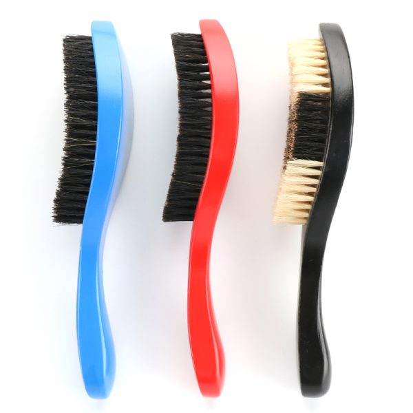 Three Marathon Wave Brushes with curved handles are arranged in a row. The handles are blue, red, and black; each has dark bristles, with the black-handled brush having lighter bristles. Ideal for any barber in Bartow looking to add quality tools to their setup.