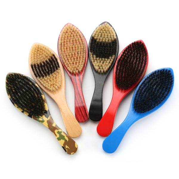 A collection of seven Marathon Wave Brushes, featuring various colored handles and bristles, arranged in a fan-like pattern—perfect for any barber in Bartow.
